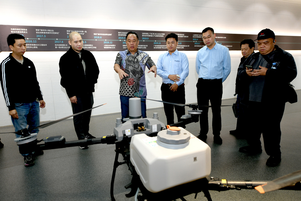 Cik Ujang (third from left) visits the training base